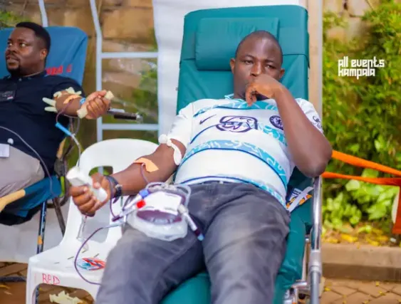 A man donates blood at Ssese Nation's drive