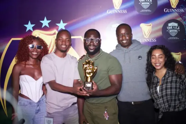 Ronnie Kasujja being awarded the golden glove