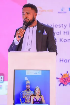 Reach A Hand CEO Humphrey Nabimanya addreses guests in Lungujja