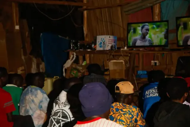 Youths watching film at a cinema in Uganda courtesy of Kwiso Mu Cinema