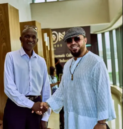 Legendary Ugandan actor Michael Wawuyo Sr shares a warm handshake with Nigerian producer and actor Ramsey Nouah during last year's iKON Activate engagement in Nigeria. iKON Awards